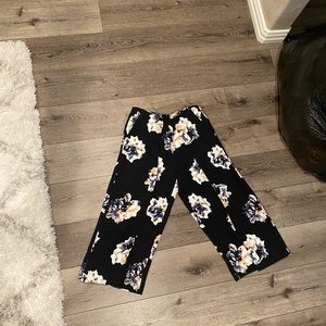 Black dressy pants with a flower print. Size 0